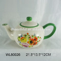 Ceramic teapot with flower decal design